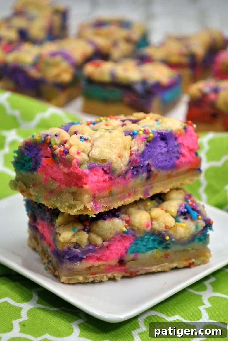 These unicorn bars are a delicious mix between sugar cookies and cheesecake and are decorated to give them a magical unicorn look.