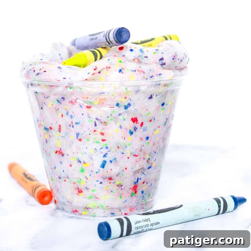 Colorburst Crayon Slime 2 A colorful batch of crayon slime stored in an airtight container, ready for play. Emphasizes the vibrant colors from recycled crayons.