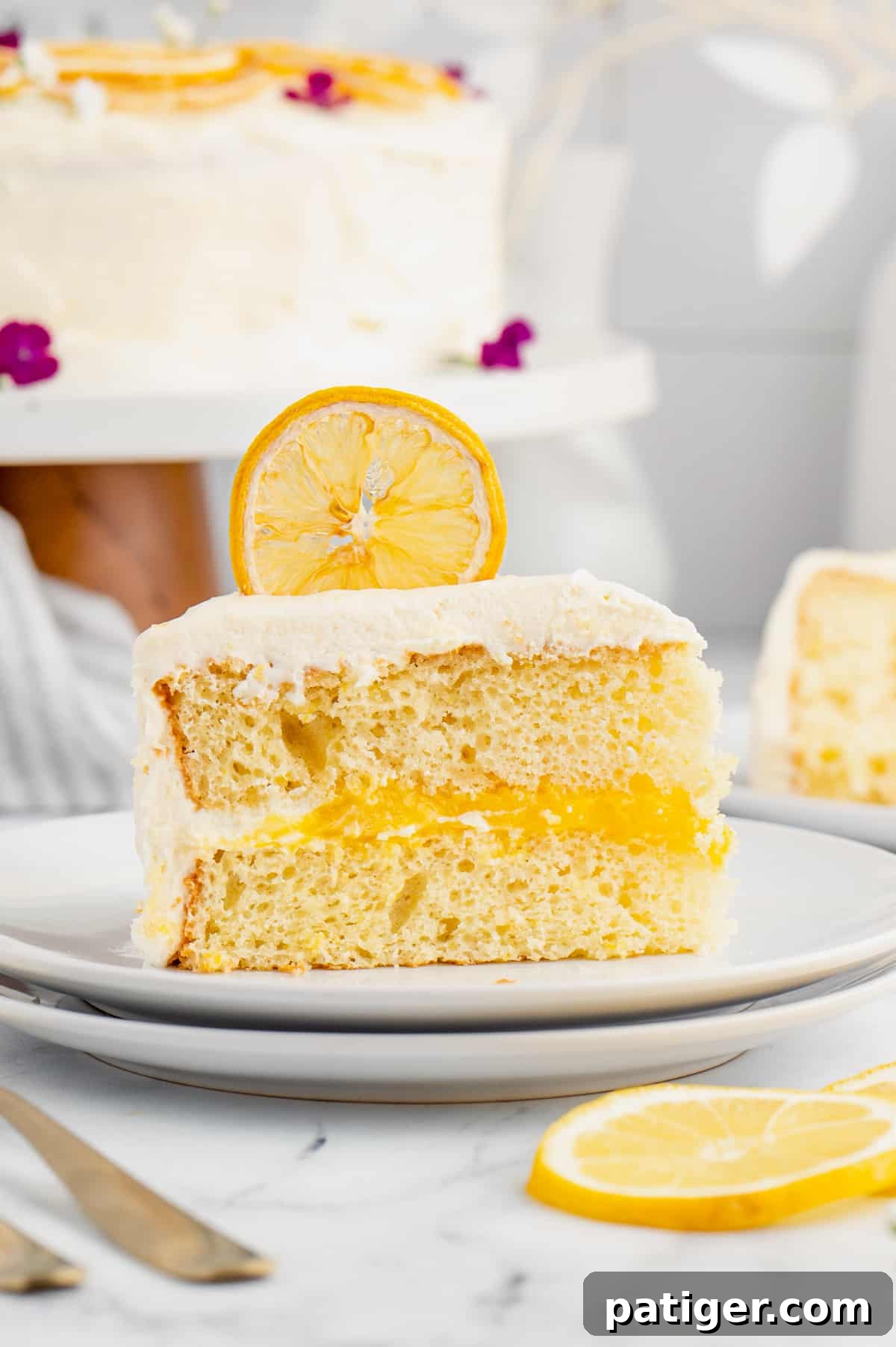 Lemon layered cake with lemon curd filling and lemon frosting.