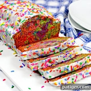 Unicorn bread covered in vanilla glaze and rainbow sprinkles.