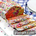 Unicorn bread covered in vanilla glaze and rainbow sprinkles.