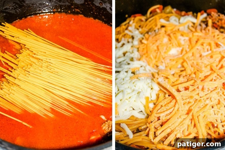 Spaghetti and cheese being added to the pot of taco meat and sauce