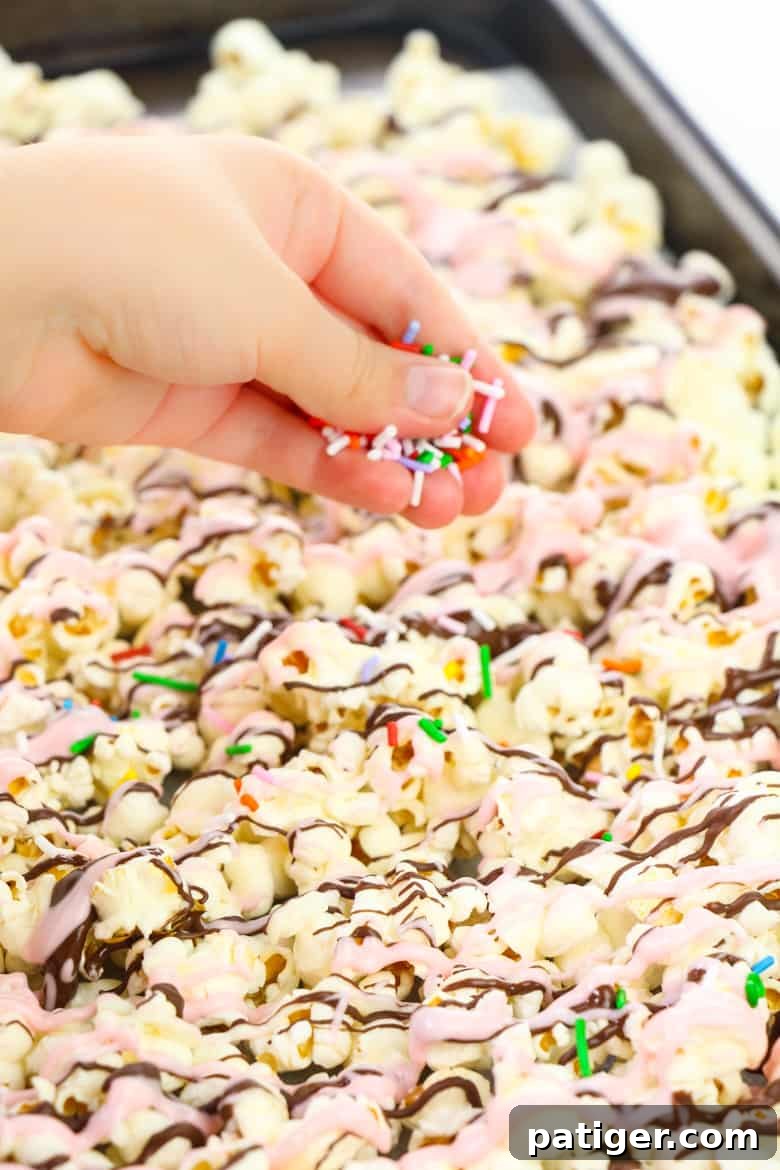 Finished Sundae Chocolate Covered Popcorn on a baking sheet, ready to set