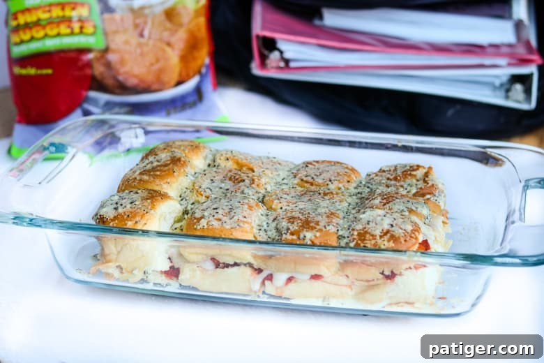 Hawaiian roll chicken parm sliders in a 9x13 casserole dish, ready to be served.