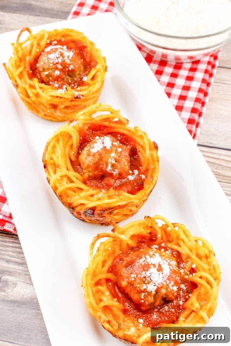 Spaghetti and Meatball Nests 3 Spaghetti and Meatball Cups on a white serving platter