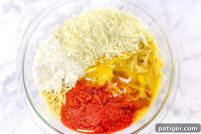 Spaghetti and Meatball Nests 4 Spaghetti, cheese, marinara, egg in glass mixing bowl