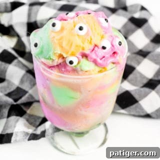 Rainbow sherbet topped with candy eyeballs