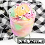 Rainbow sherbet topped with candy eyeballs
