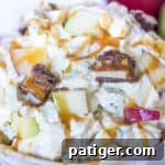 Ultimate Snickers Caramel Apple Salad 8 Snickers Salad with Snickers Bars next to the bowl