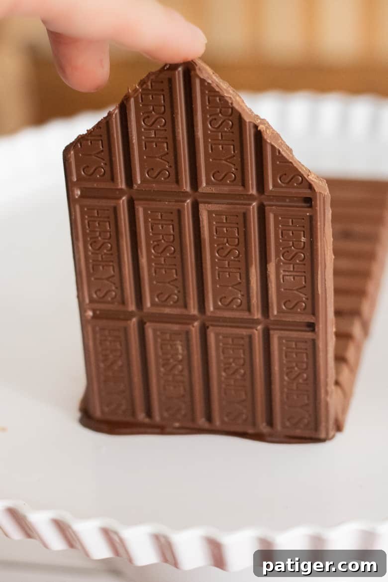 Festive Sweet Retreat 4 Wall made of chocolate Hershey bar being attached to kit kat base.