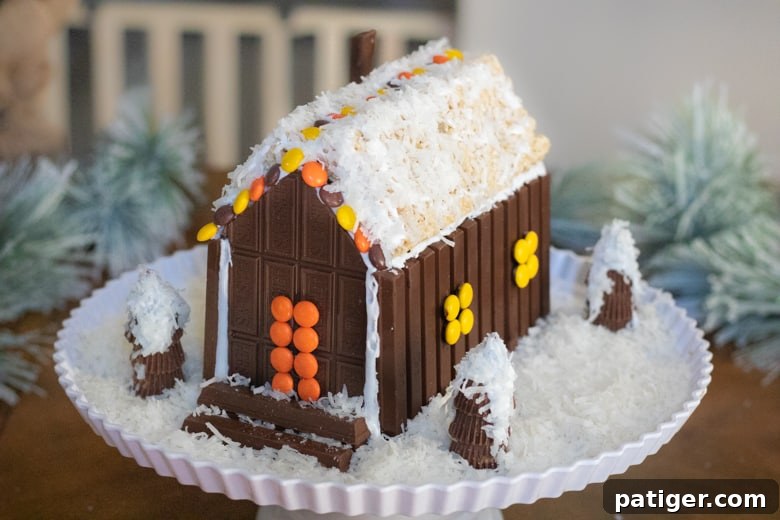 Festive Sweet Retreat 8 Candy Christmas House made of chocolate treats.