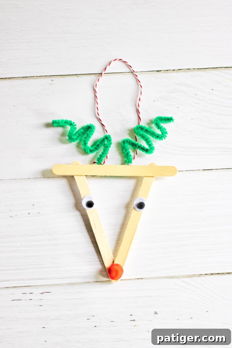 Whimsical Craft Stick Reindeer Decor 2 Easy reindeer Christmas ornament made with popsicle sticks