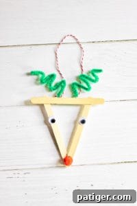 Finished reindeer Christmas ornament with popsicle sticks, complete with a hanger and ready for display