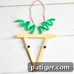 Small close-up of reindeer Christmas ornament with popsicle sticks