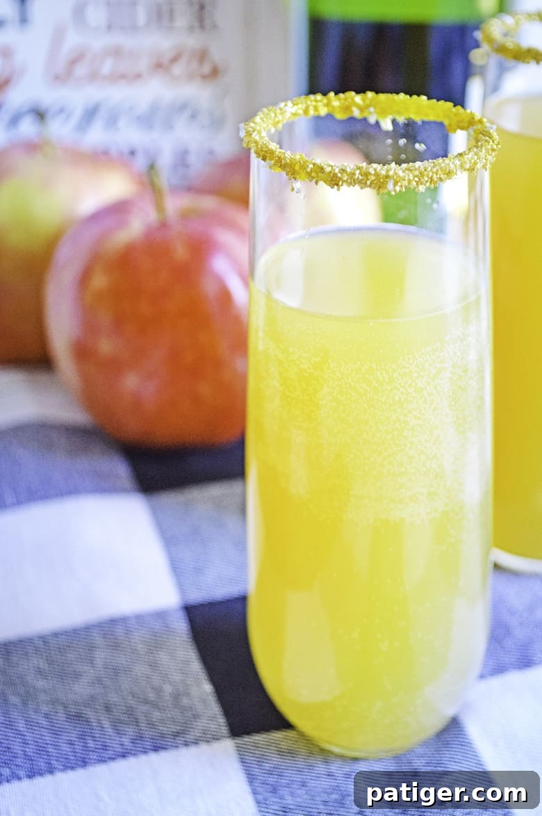 A festive display of apple cider mimosas on a table, ready for a holiday celebration.
