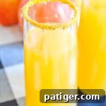 apple cider mimosas sitting on a table