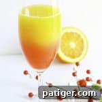 christmas mimosa recipe in cocktail glass