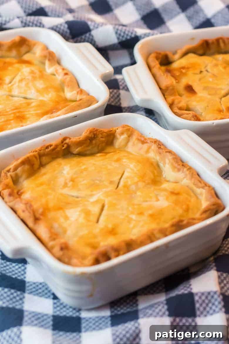 Comforting Individual Chicken Pot Pies 6 Close-up of a bubbling individual chicken pot pie with a golden crust