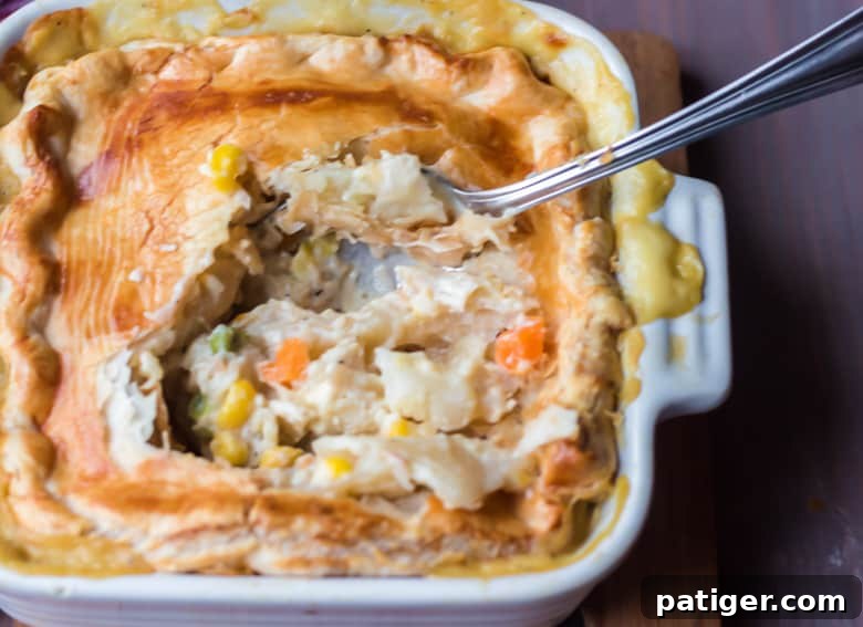Comforting Individual Chicken Pot Pies 7 Cut individual chicken pot pie showing the rich and creamy chicken and vegetable filling