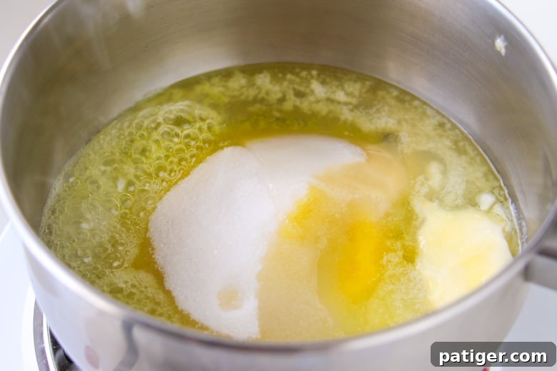 Butter, sugar, and corn syrup simmering in a saucepan