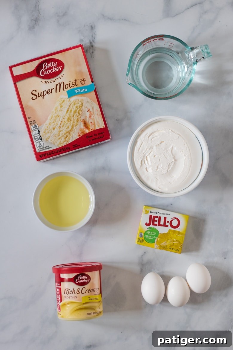Ingredients for Lemon Poke Cake: Box of Betty Crocker White Cake Mix, Cool Whip, oil, Lemon Jell-O Mix, Lemon Frosting, and 3 eggs