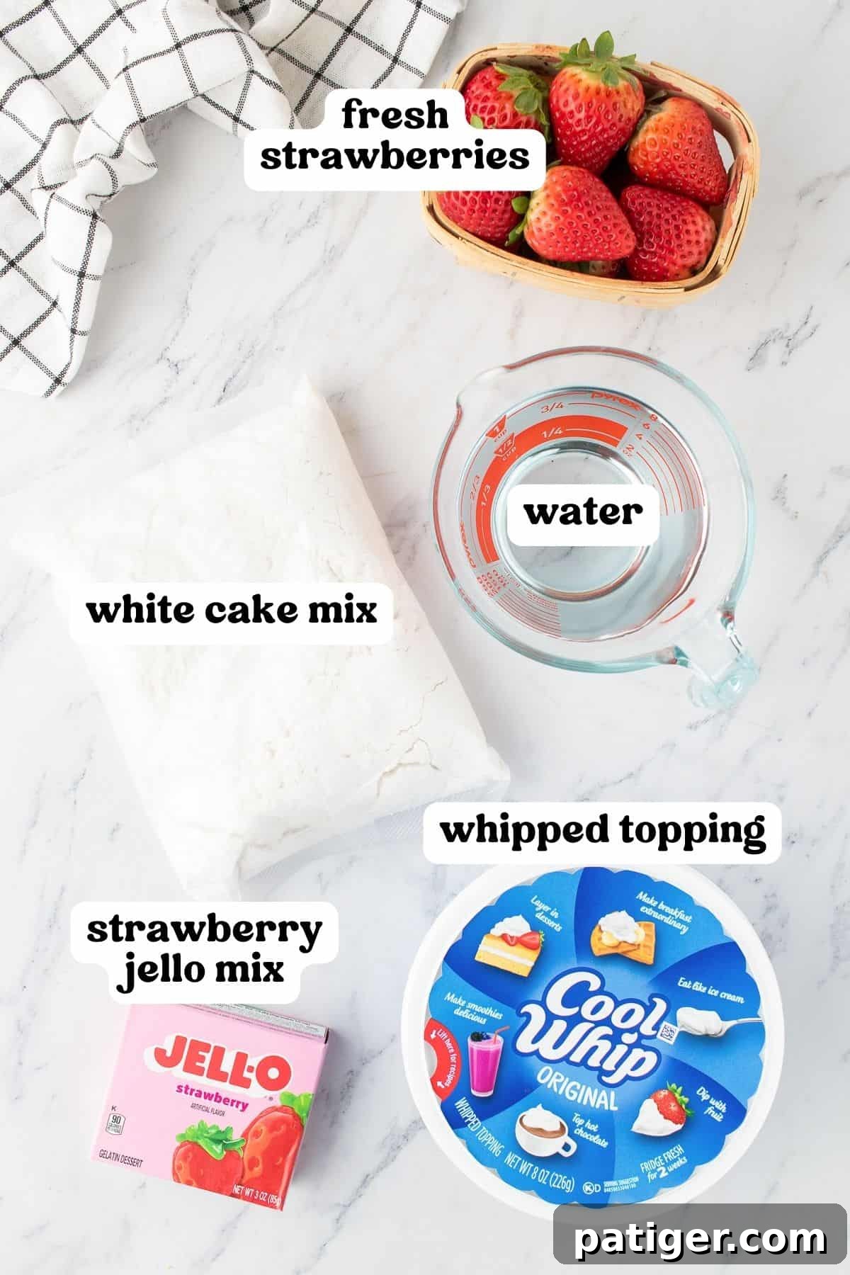 Strawberry Infusion Poke Cake 3 A selection of ingredients for making strawberry jello poke cake: a box of white cake mix, a box of strawberry jello, fresh strawberries, water, and a container of Cool Whip.
