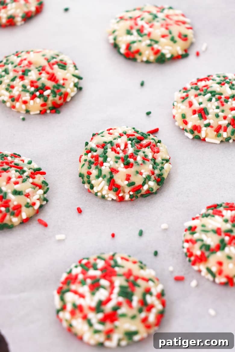 No Roll Sugar Cookies dough balls ready on a baking sheet lined with parchment paper
