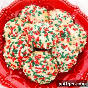 sugar cookies with sprinkles on red dish