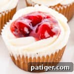 Cherry Pie Cupcakes with buttercream frosting and cherry pie filling