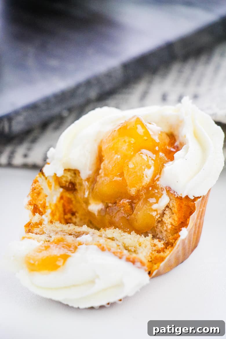 Spiced Apple Crumble Cupcakes 3 Close-up of Apple Pie Filled Cupcakes with a generous swirl of buttercream