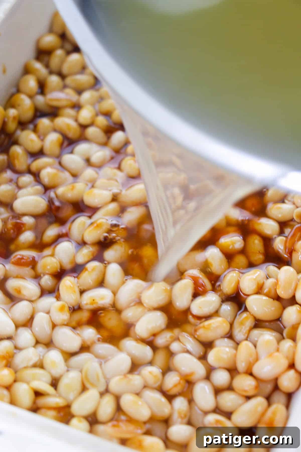 Ultimate Boston Baked Beans 8 Bowl of water being poured in to bean dish.