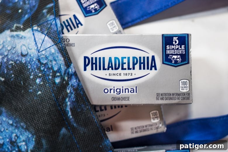 Close-up of a block of Philadelphia Original Cream Cheese, emphasizing its premium quality.