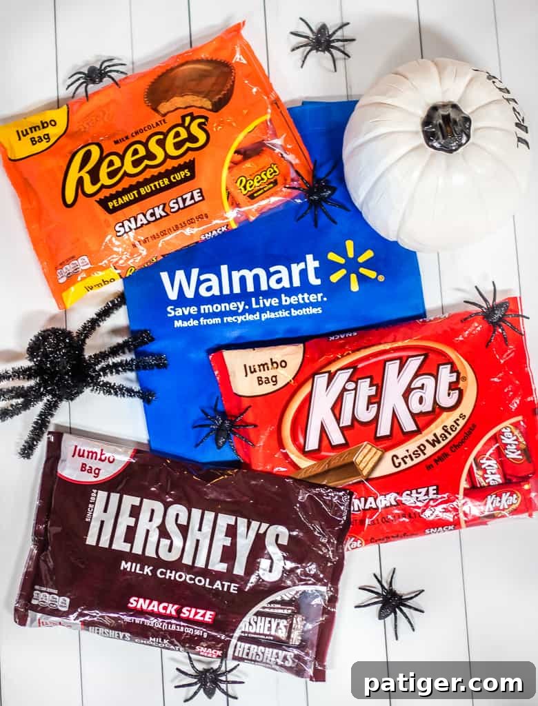 A festive selection of HERSHEY® Halloween Candy from Walmart, including REESE’S Peanut Butter Cups, KIT KAT® Bars, and HERSHEY’S Milk Chocolate, ready for baking and trick-or-treating.