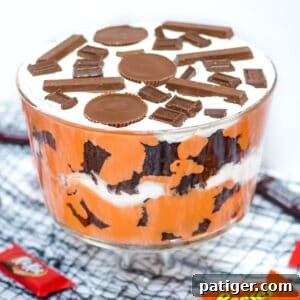 Halloween Candy Trifle, a layered dessert with brownies, pudding, and candy
