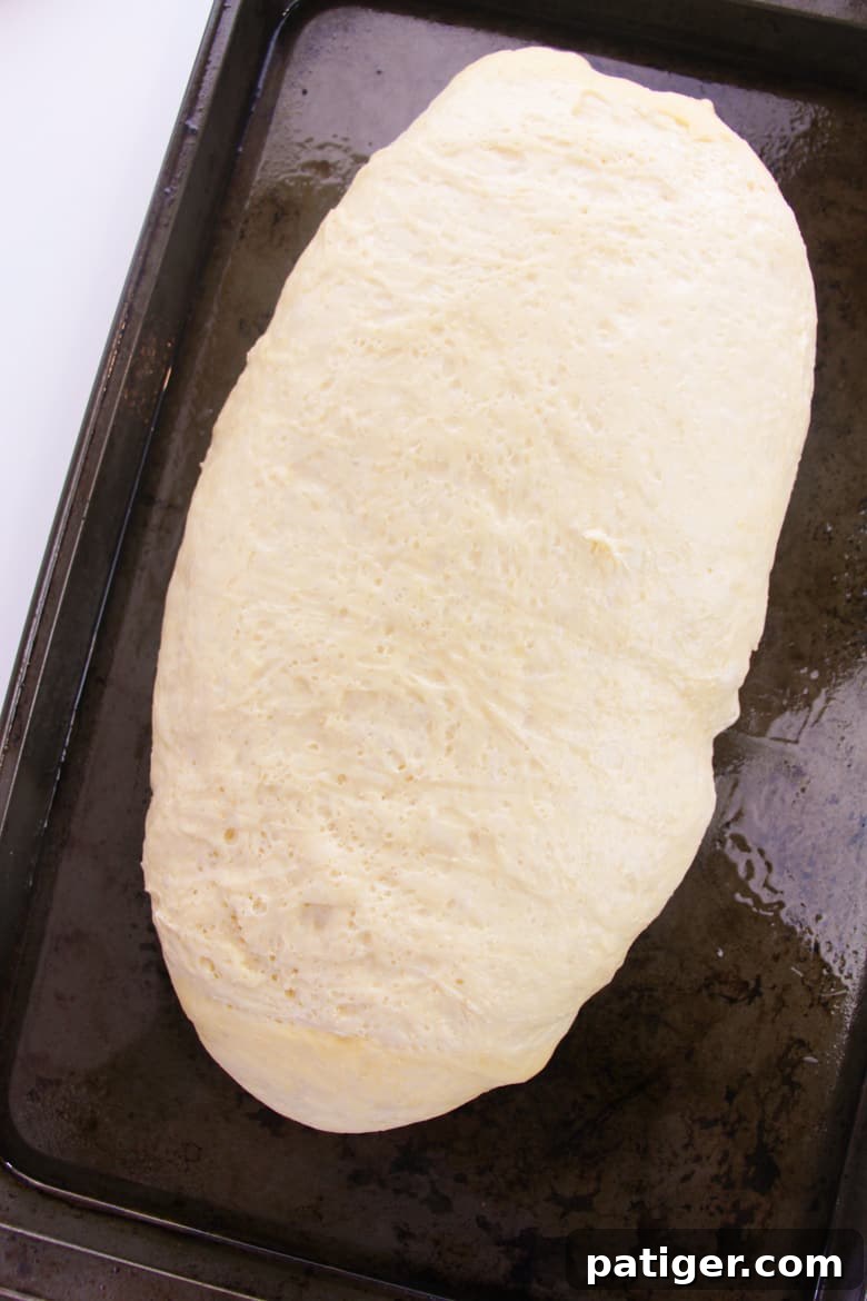 Aromatic Italian Herb Loaf 6 Risen bread dough on baking sheet