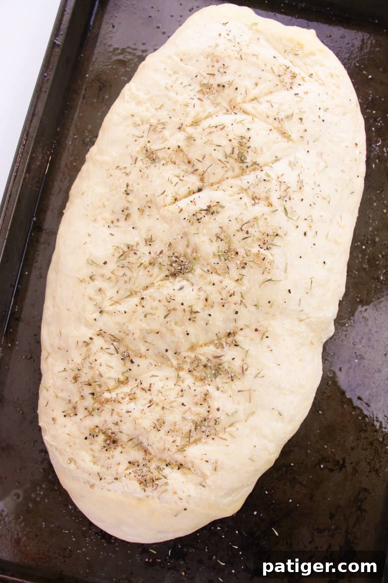 Aromatic Italian Herb Loaf 7 Dough topped with italian seasoning