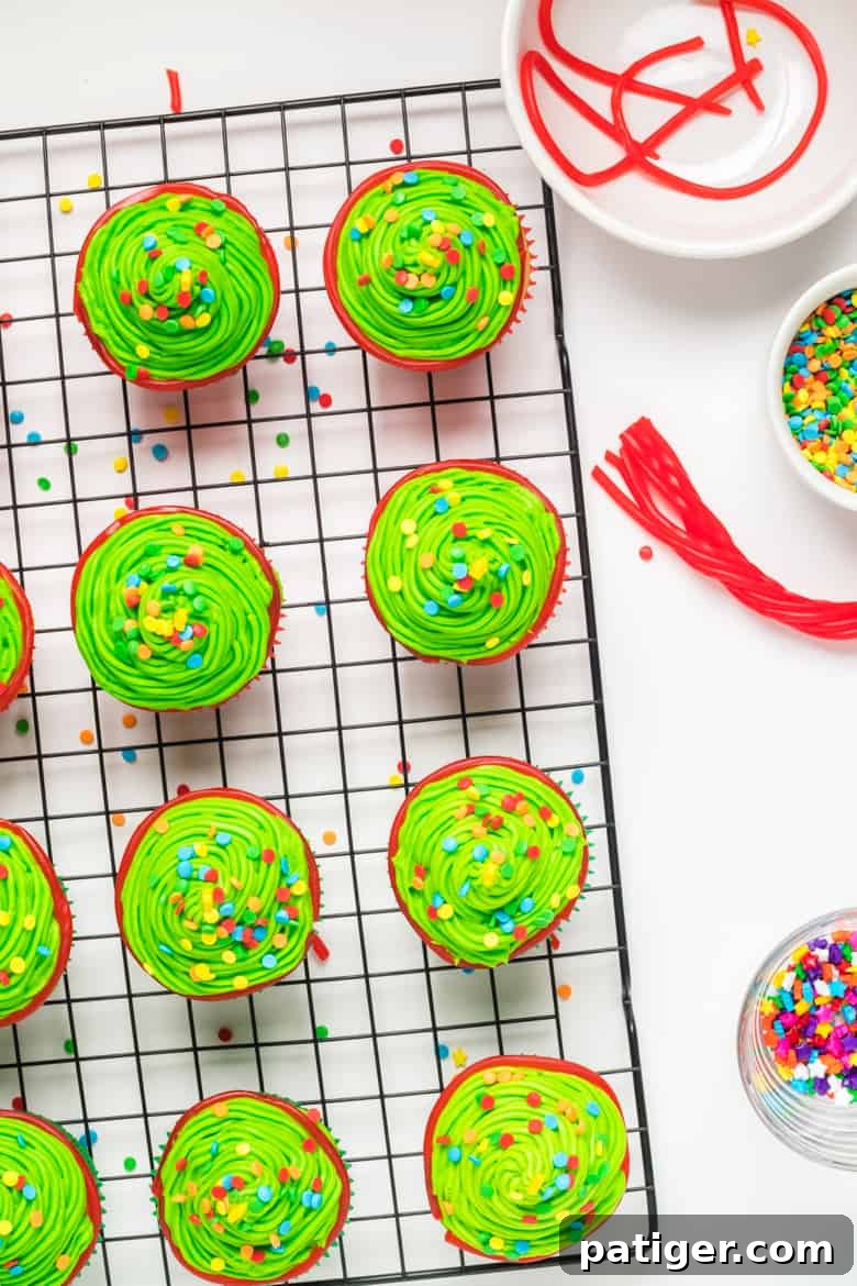 Decorated Christmas Tree Cupcakes with sprinkles and a star on top
