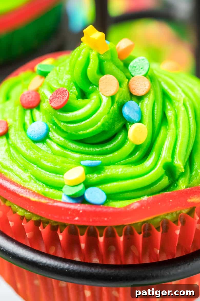 Close-up of vibrant green icing with a single rainbow sprinkle
