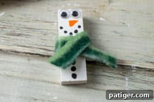 Charming Wooden Block Snowmen 9 Wood block painted to look like snowman with a piece of fabric glued on to look like scraft