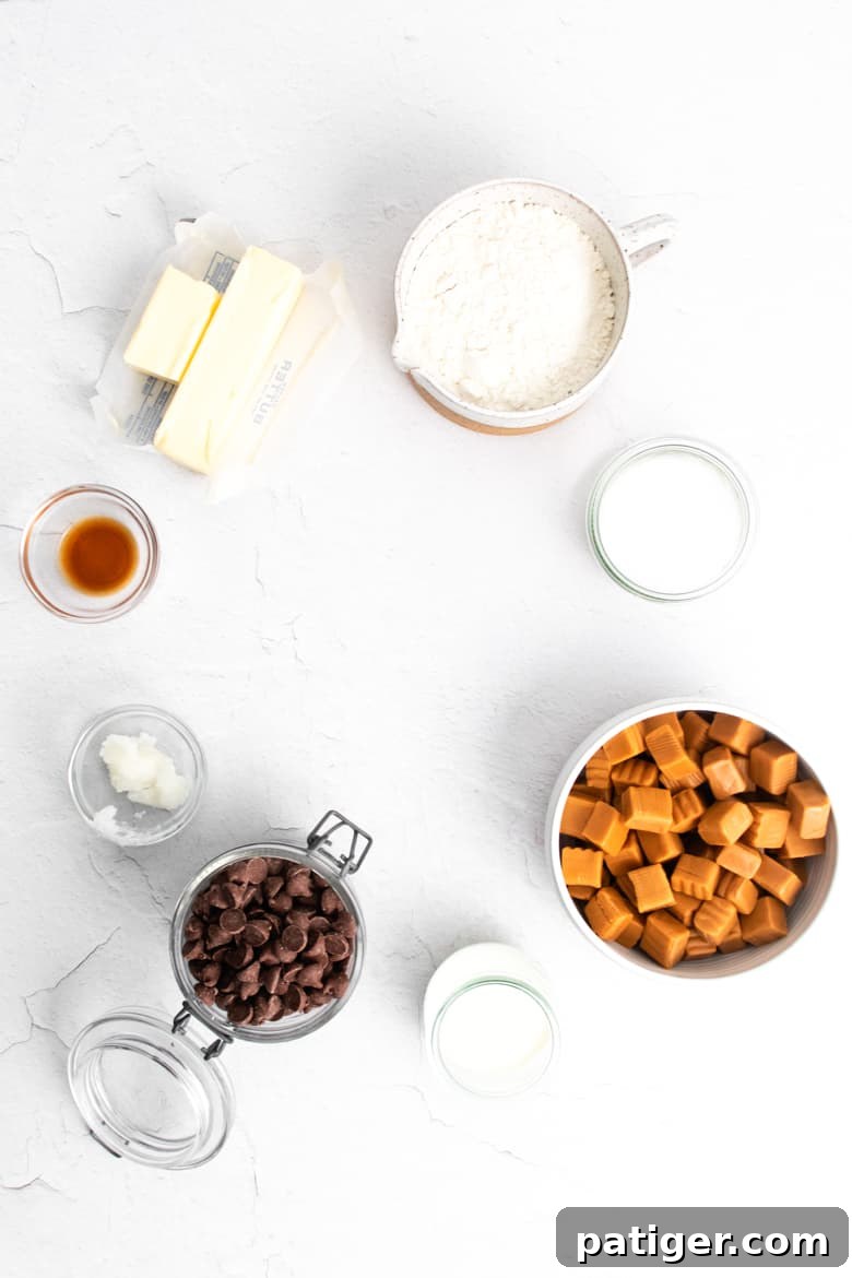 A flat lay image displaying all the necessary ingredients for crafting Homemade Twix Bars, neatly arranged.