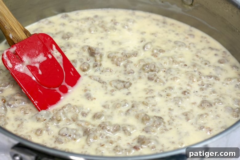A skillet brimming with perfectly thick and creamy homemade sausage gravy.