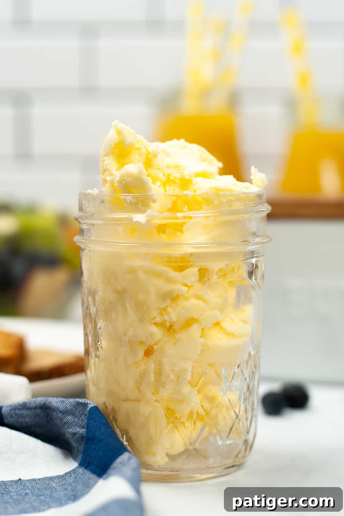 Mason jar filled with homemade butter on a kitchen countertop