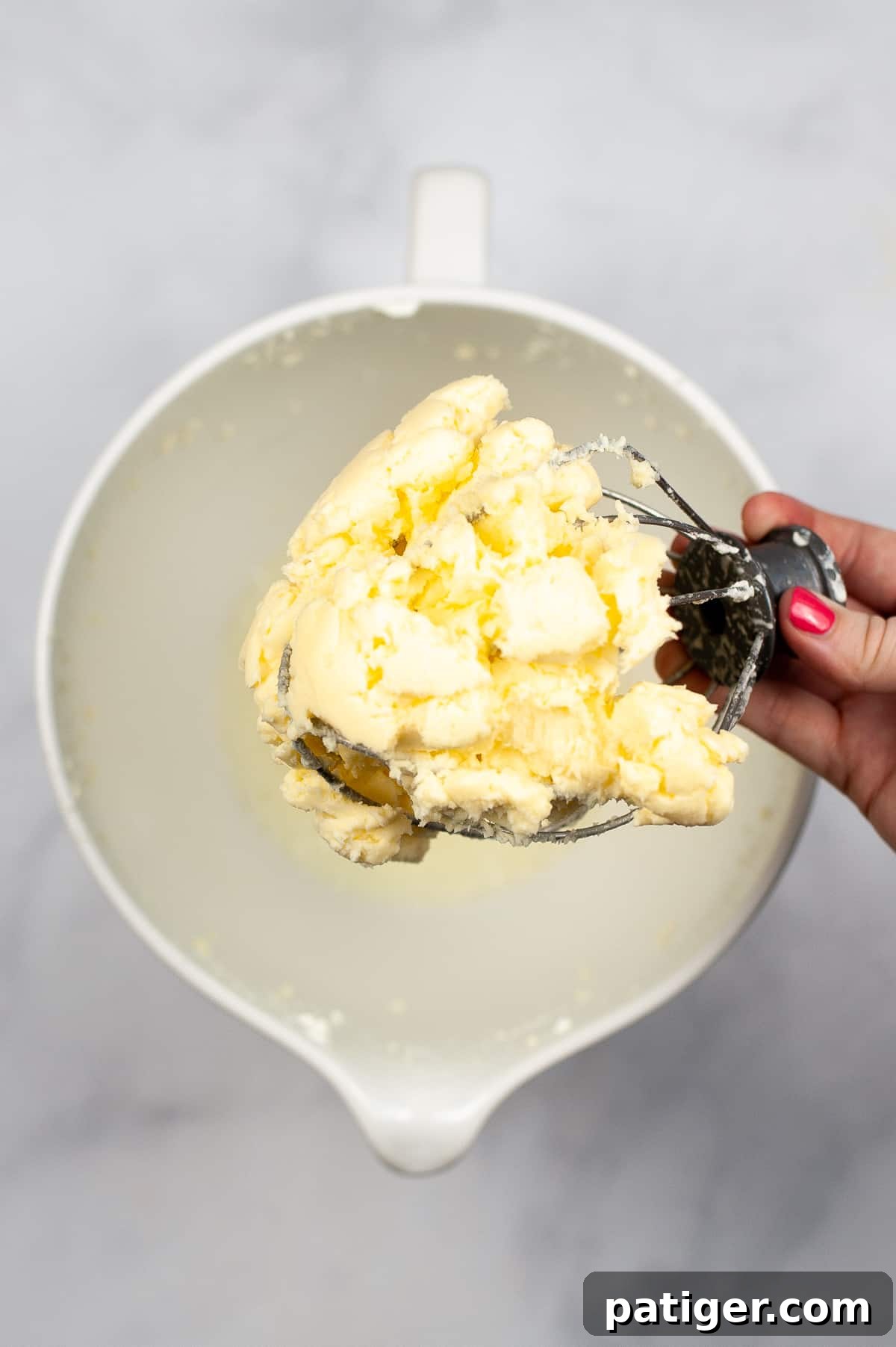 Whisk mixer attachment with glob of butter stuck to it