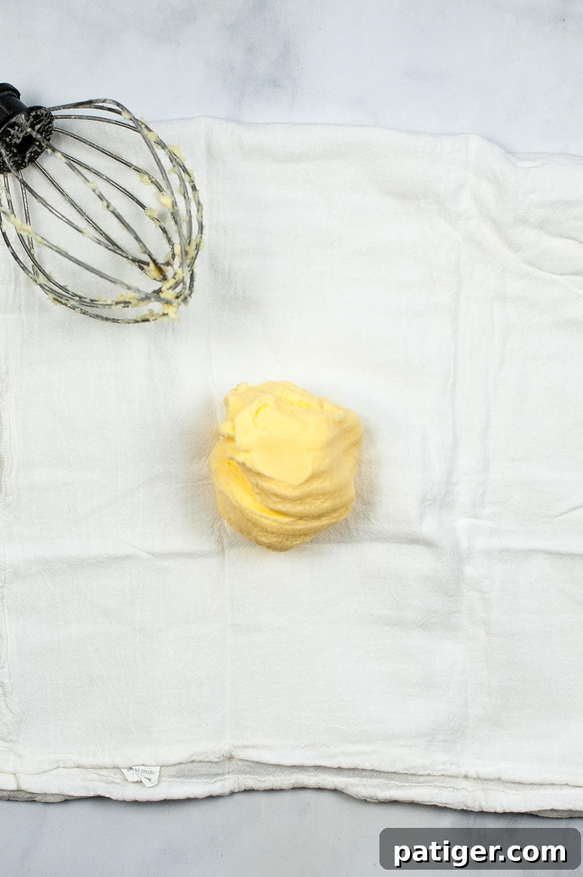 Ball of butter in center of cheesecloth