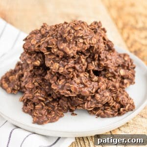 Chocolate peanut butter no bake cookies with oatmeal on a plate.