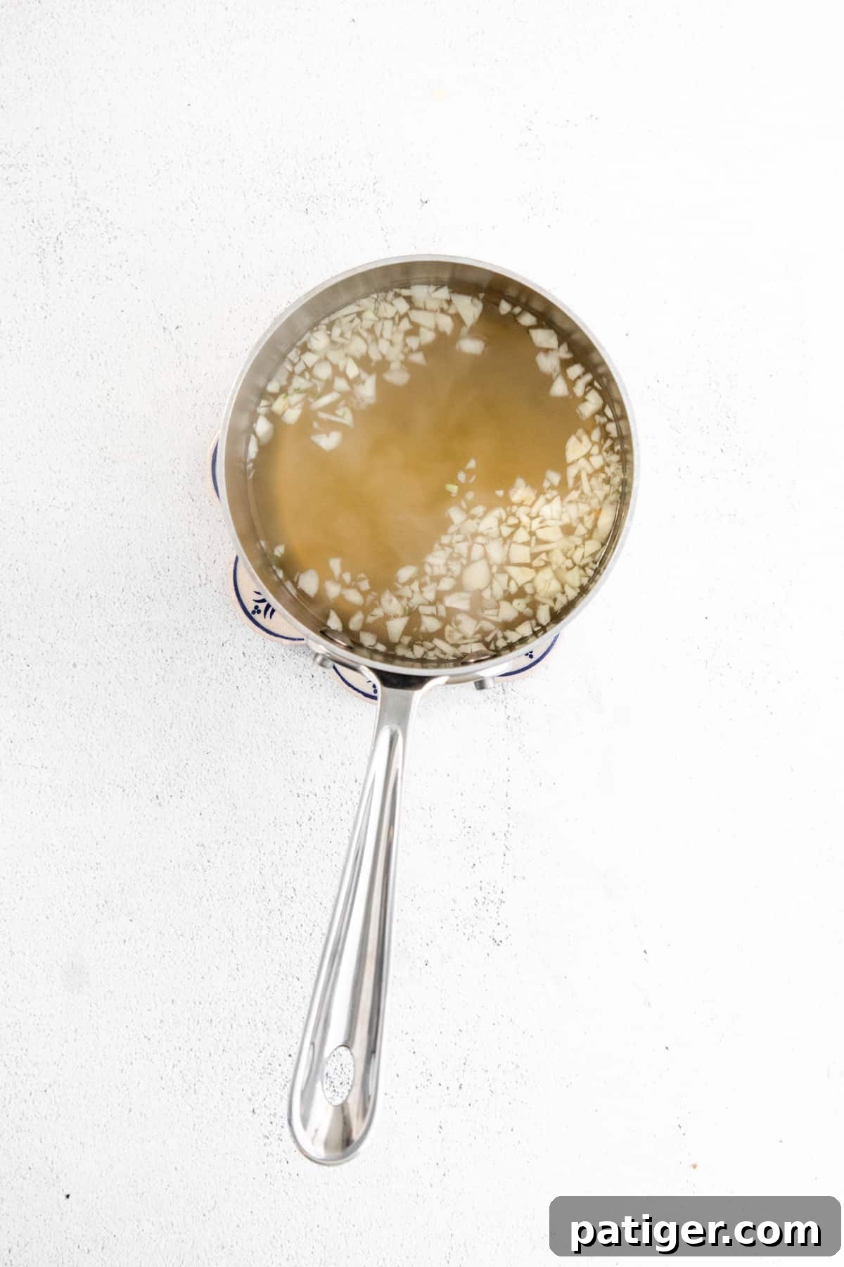 Effortless Fridge Pickles 6 Pickling brine simmering in a saucepan