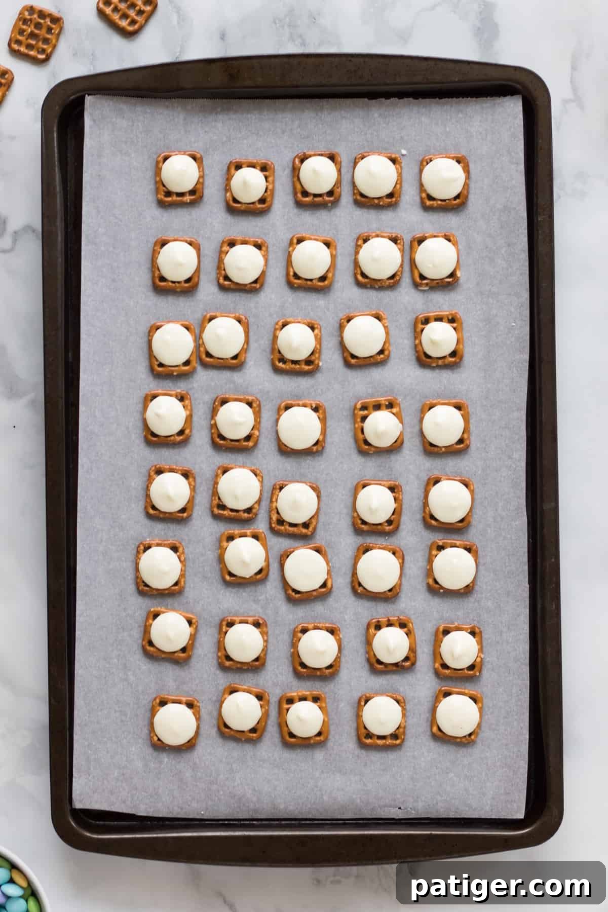 Pretzels topped with softened white chocolate