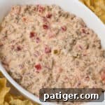 Rotel sausage cream cheese dip with tortilla chips, ready to share