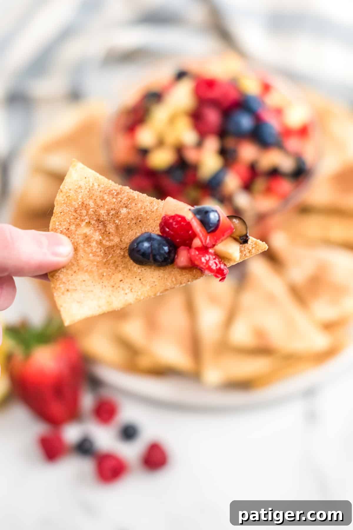 Homemade cinnamon chip with chopped fruit salsa on it