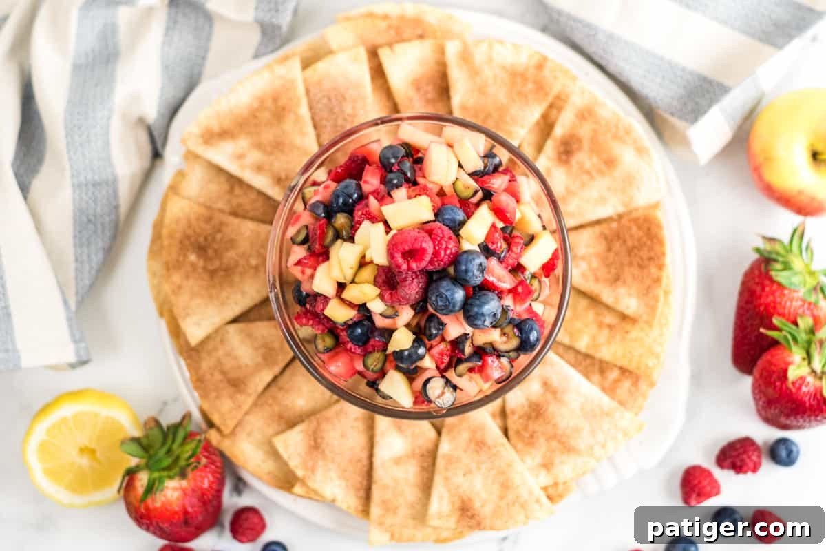 Apple and berry fruit salsa dip served with cinnamon tortilla chips for dipping